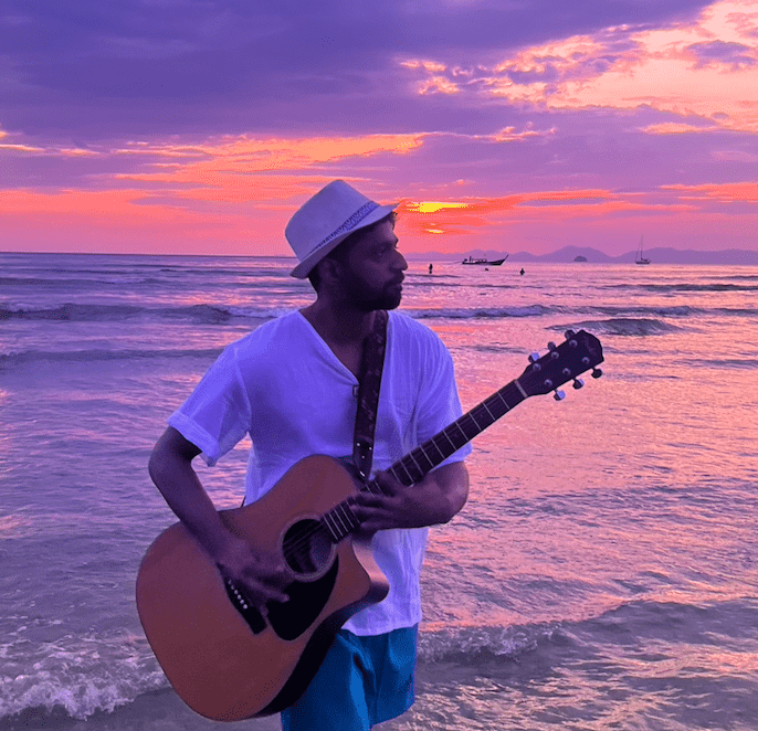 Akash Dhotre playing Guitar in Krabi
